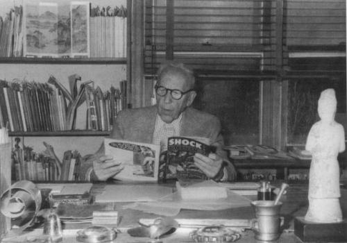 Dr. Fredric Wertham reading a comic book as part of his research.