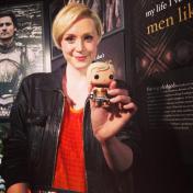 Christie at a Game of Thrones Exhibit Party displaying the Brienne of Tarth FunkoPOP figure (@gameofthrones, 2014)