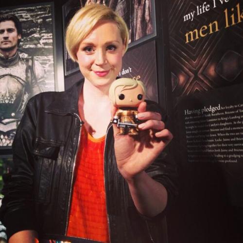 Christie at a Game of Thrones Exhibit Party displaying the Brienne of Tarth FunkoPOP figure (@gameofthrones, 2014)