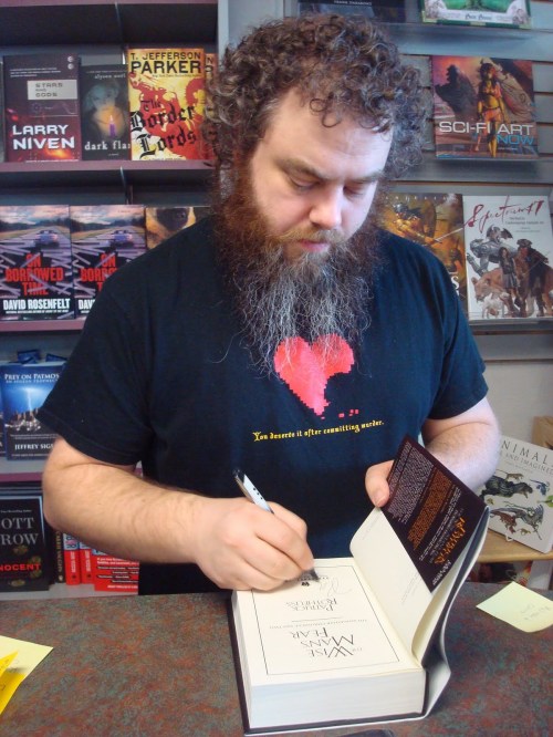 Rothfuss signing his second book (via blog.patrickrothfuss.com)